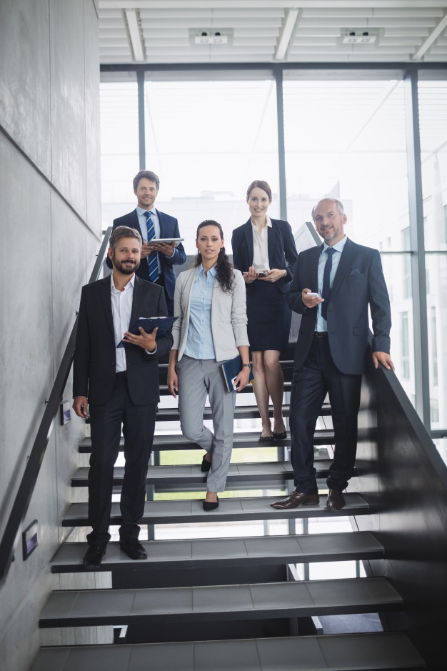 group-confident-businesspeople-office_107420-84863